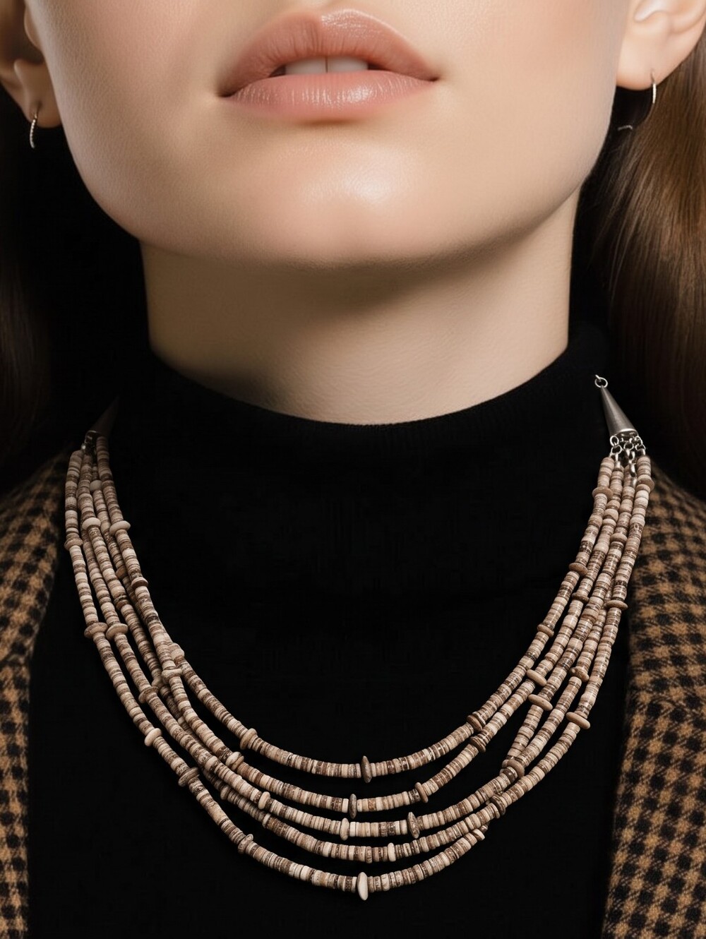Vintage 70's or 80' multistrand necklace featuring small heishi shell beads.